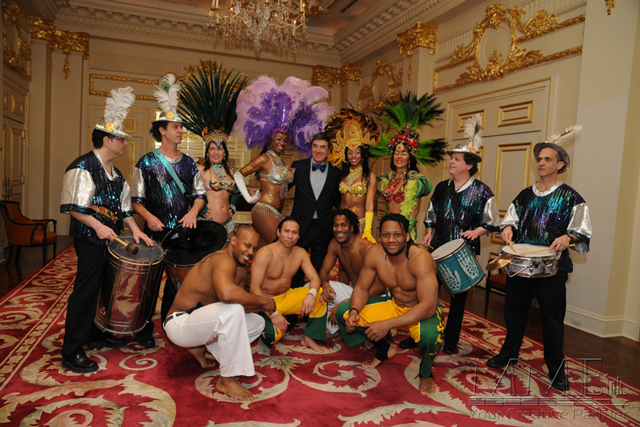 Dancers for NYC event in exotic outfits and musical instruments